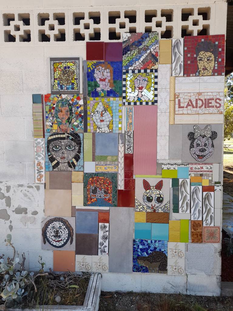 Image of a mosaic wall at Moulamein Caravan Park, curated by Sandy Peeters.